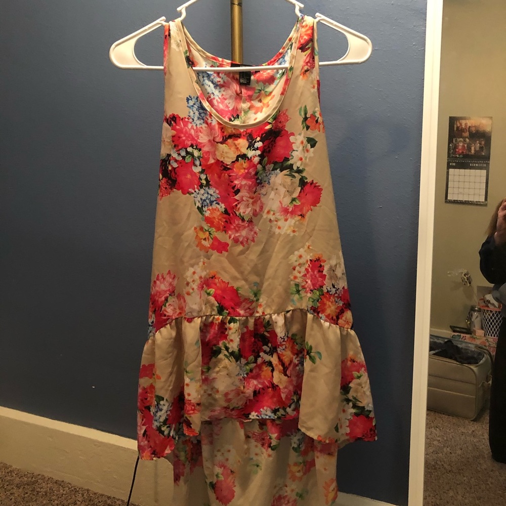High low sleeveless top, ruffled bottom